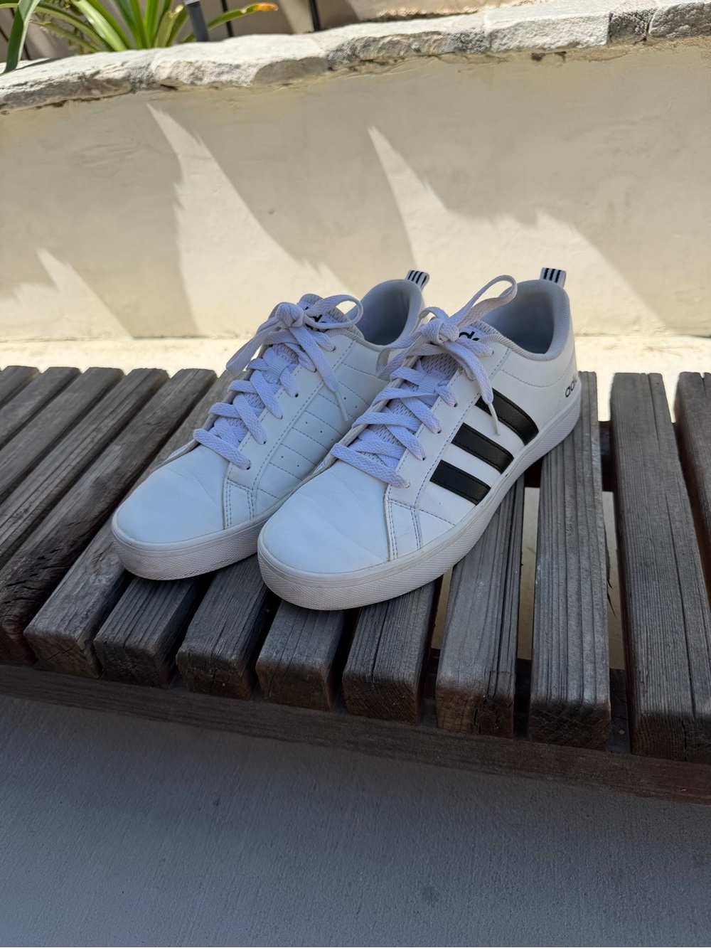 Adidas women’s White Low-Top Sneakers with Black Stripes